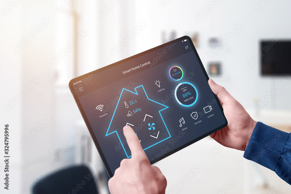 All in one smart home control system app concept on tablet display in man hands. Turn your home into a smart home