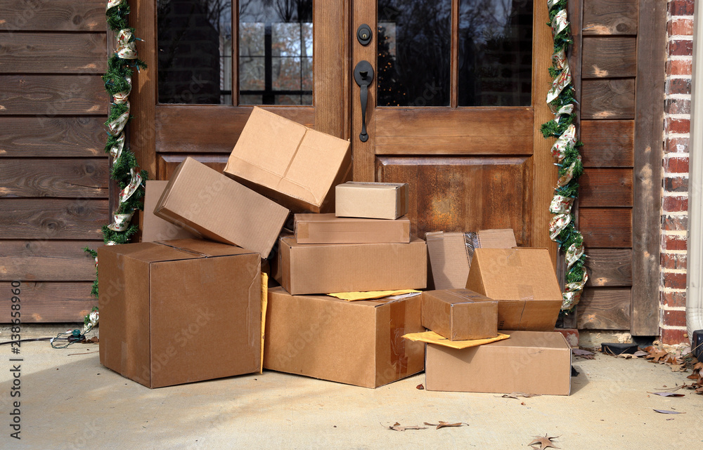 Boxes on front porch during holiday shopping season. Protecting holiday packages