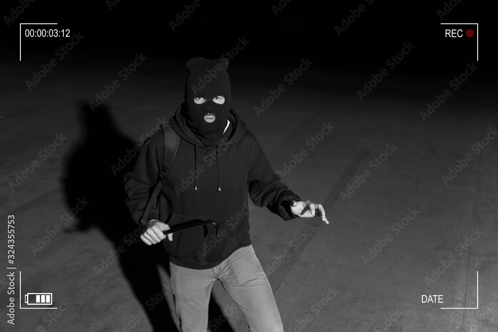 CCTV View Of Thief Standing In Dark Alley