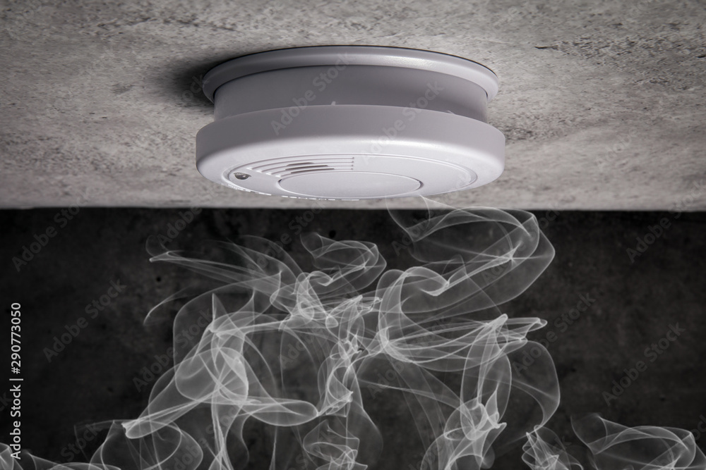 Close up smoke detector on a ceiling. Smoke, fire alarm