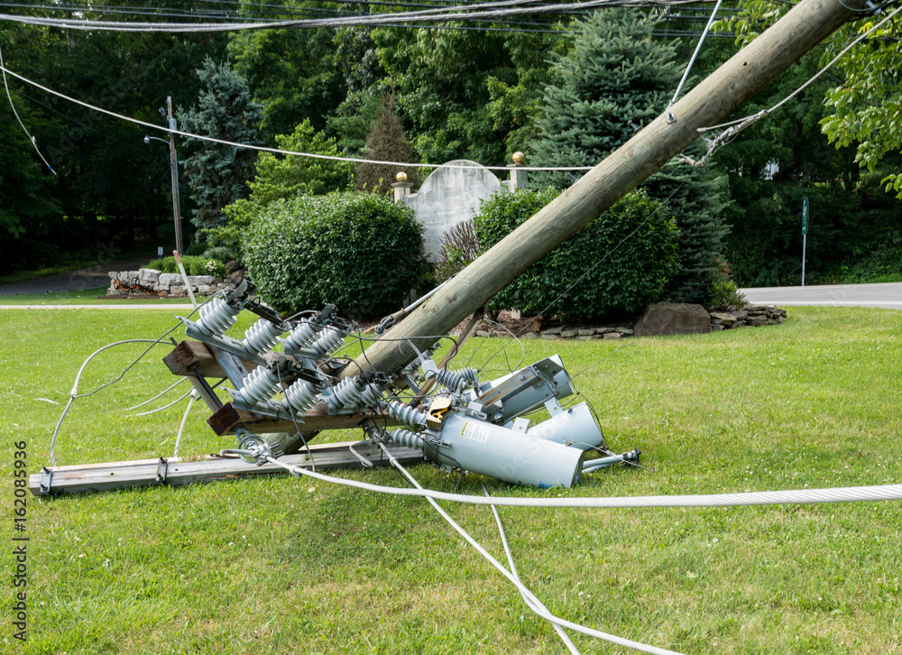 Snapped and downed power post and line after storm. Safety during power outages