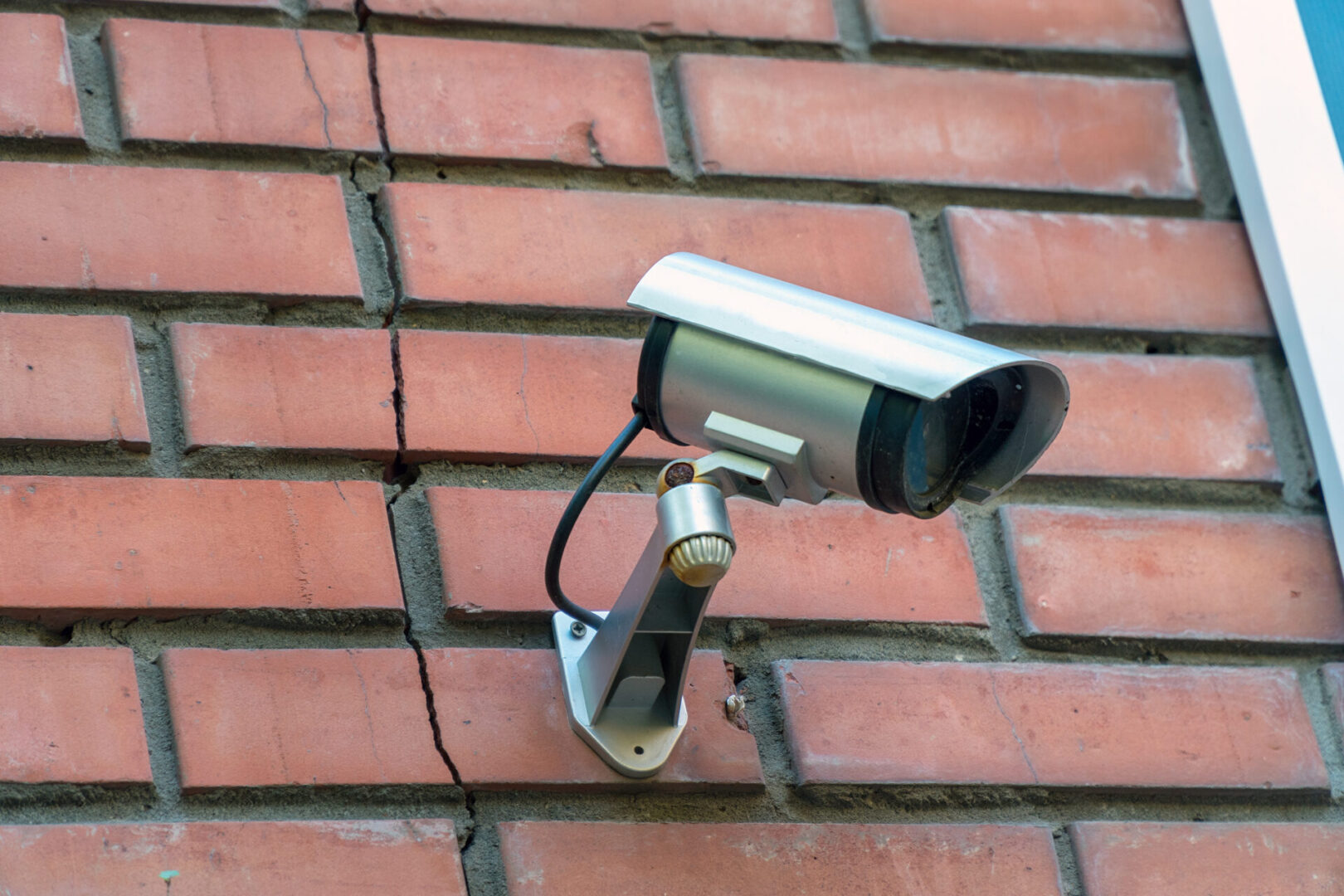 Surveillance camera mounted on wall