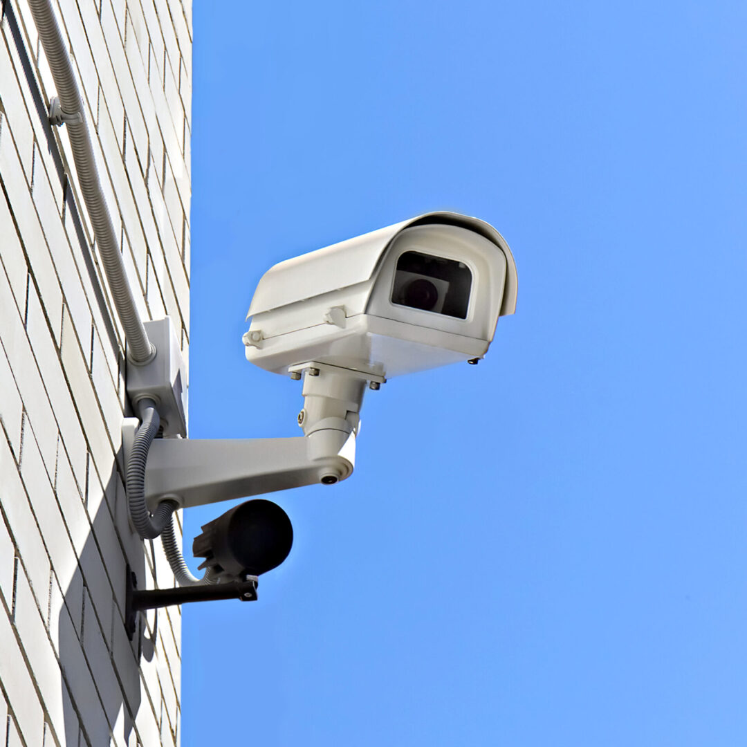 Outdoor security camera mounted on wall