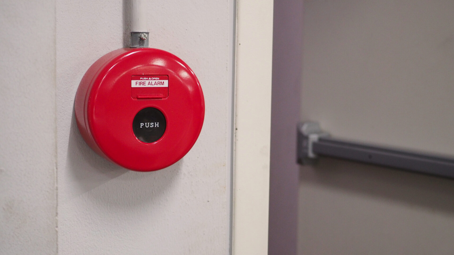 Fire alarm beside exit door