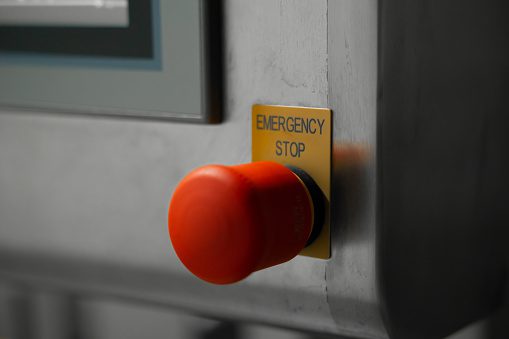 Safety emergency stop button in machinery