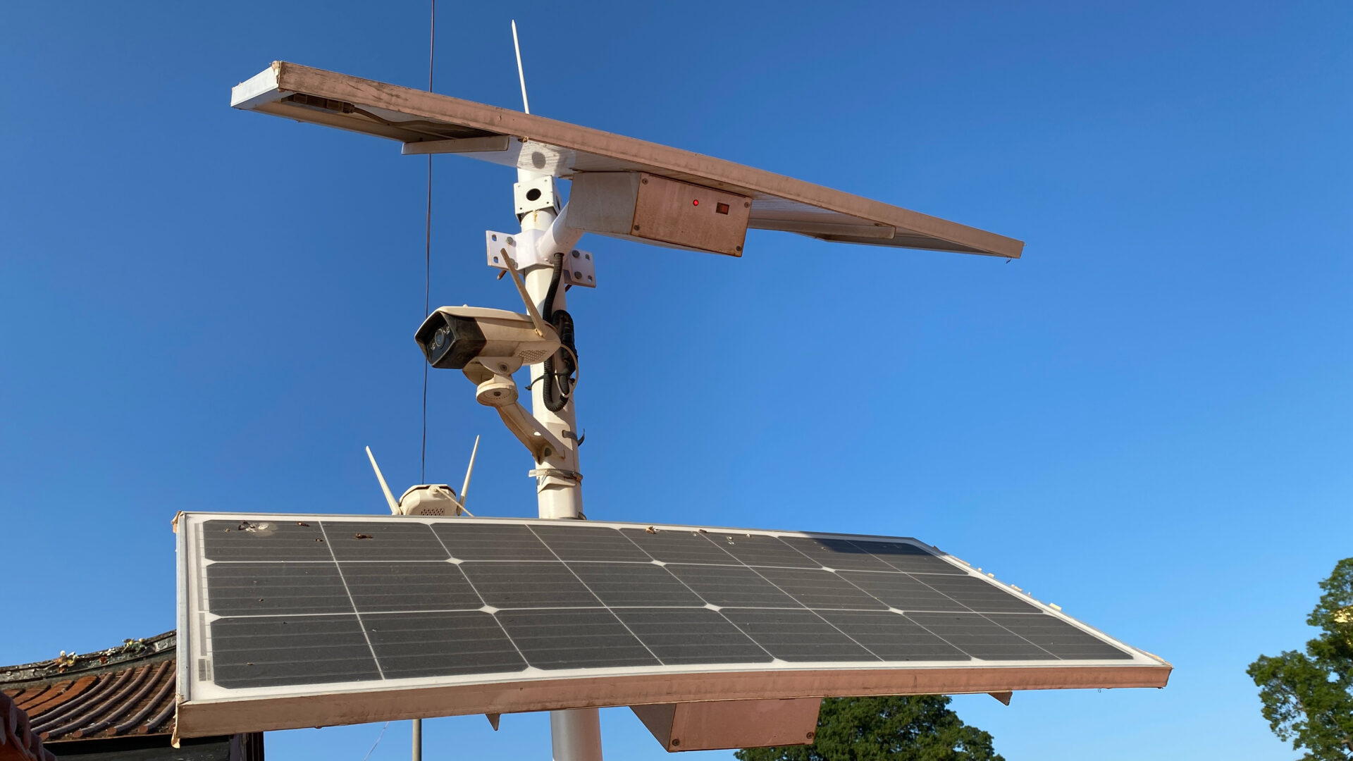 Solar-powered security system under clear sky