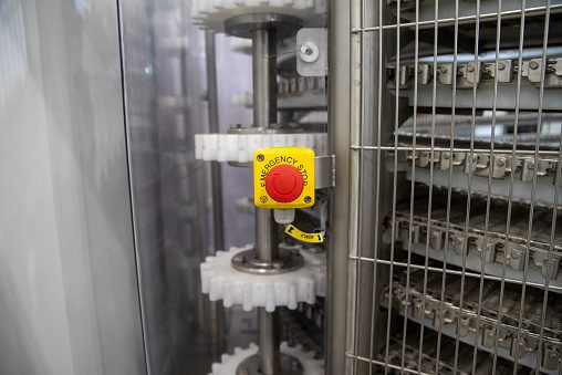 Red emergency button on factory equipment