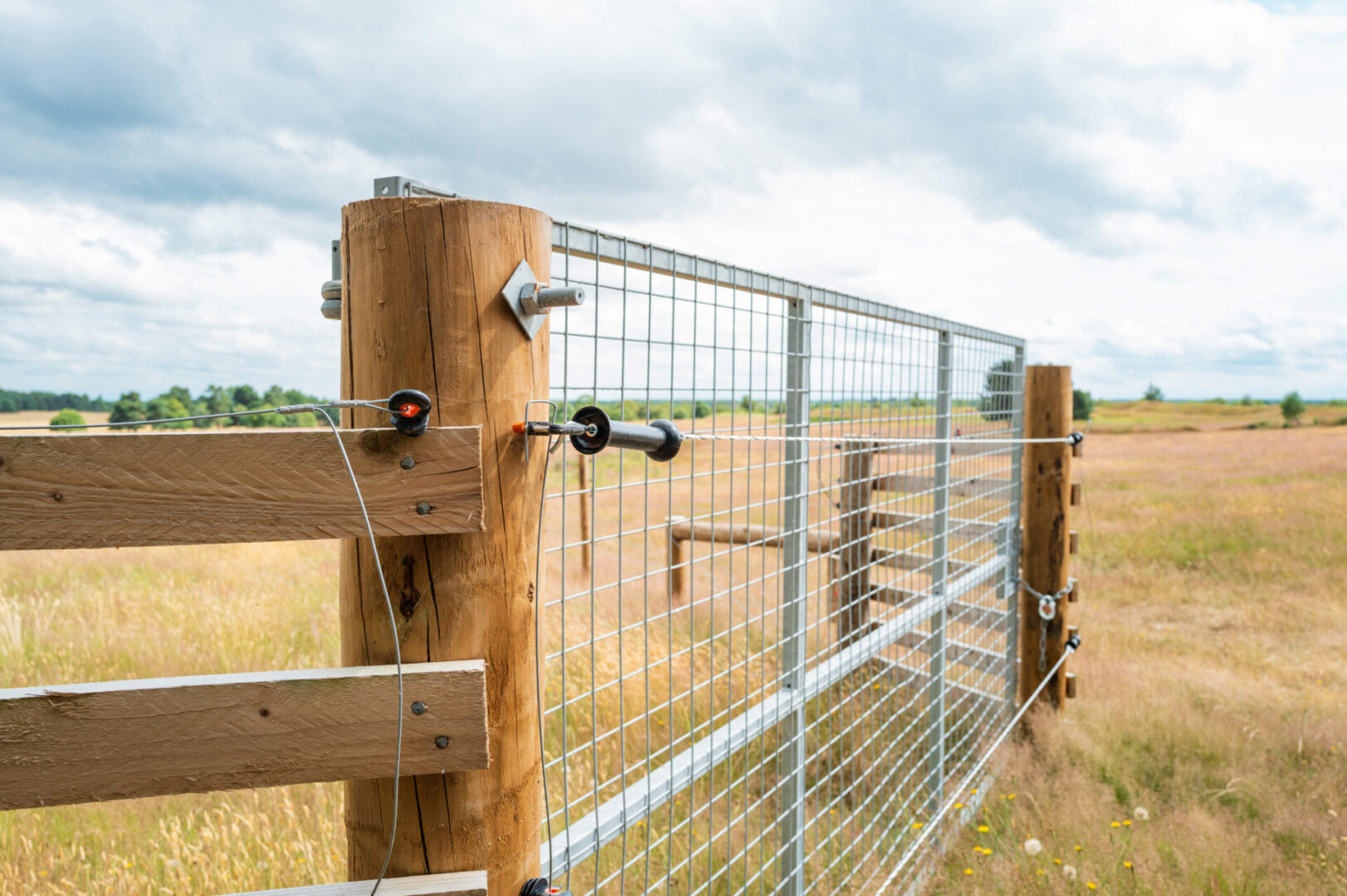 Rustic wooden gate in open field