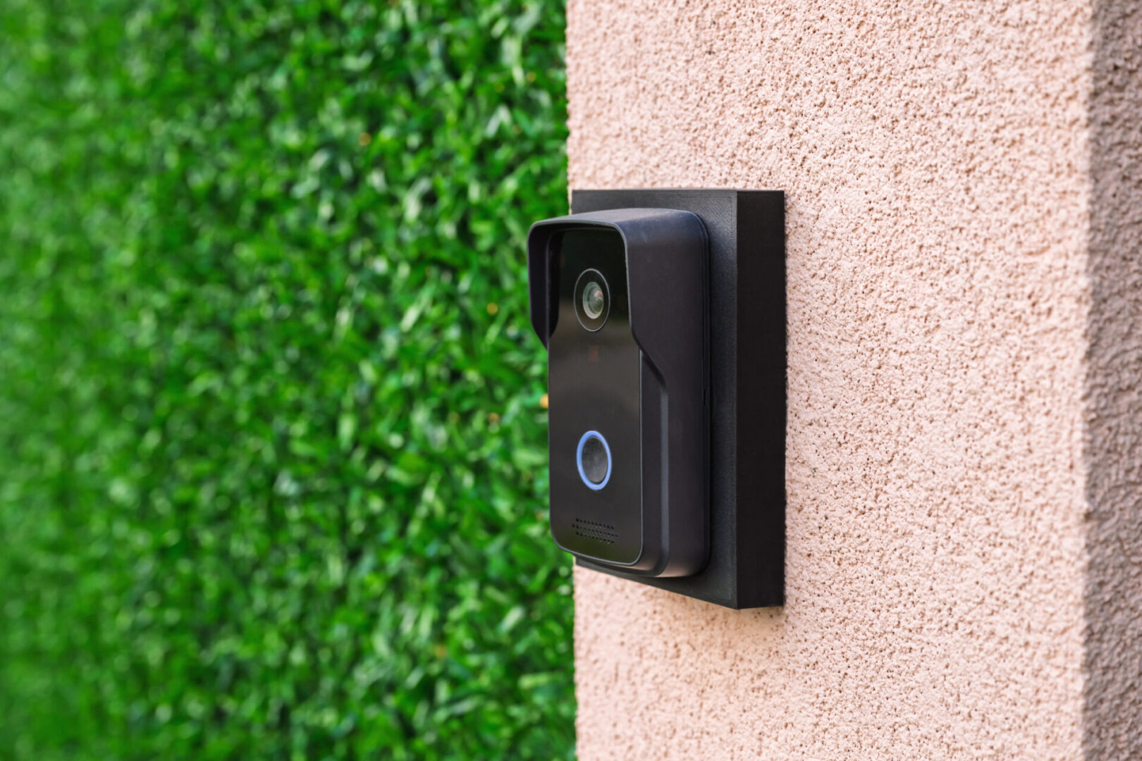 Black video doorbell with blue light