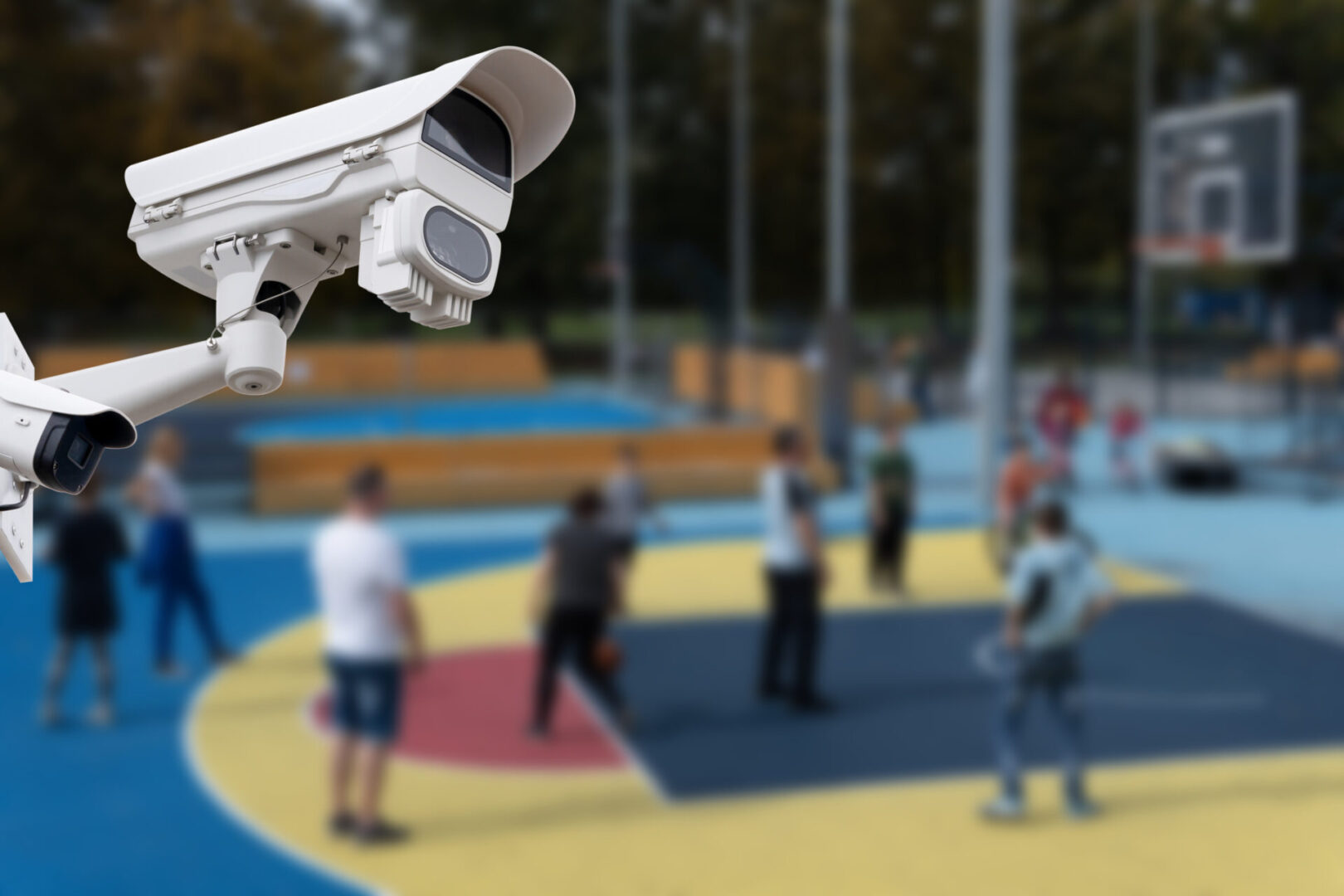 Surveillance camera monitoring outdoor basketball game