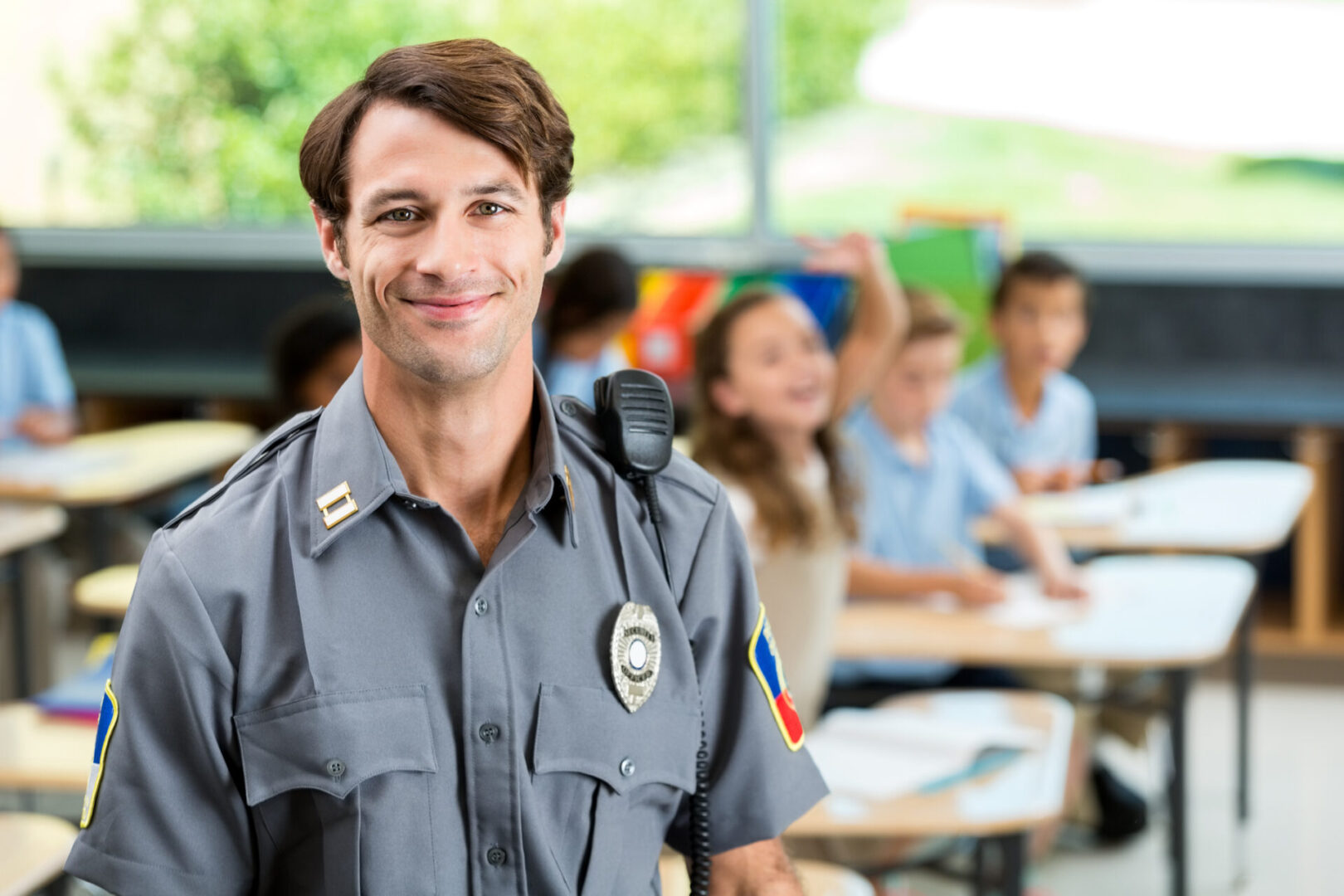 Officer standing in vibrant classroom
