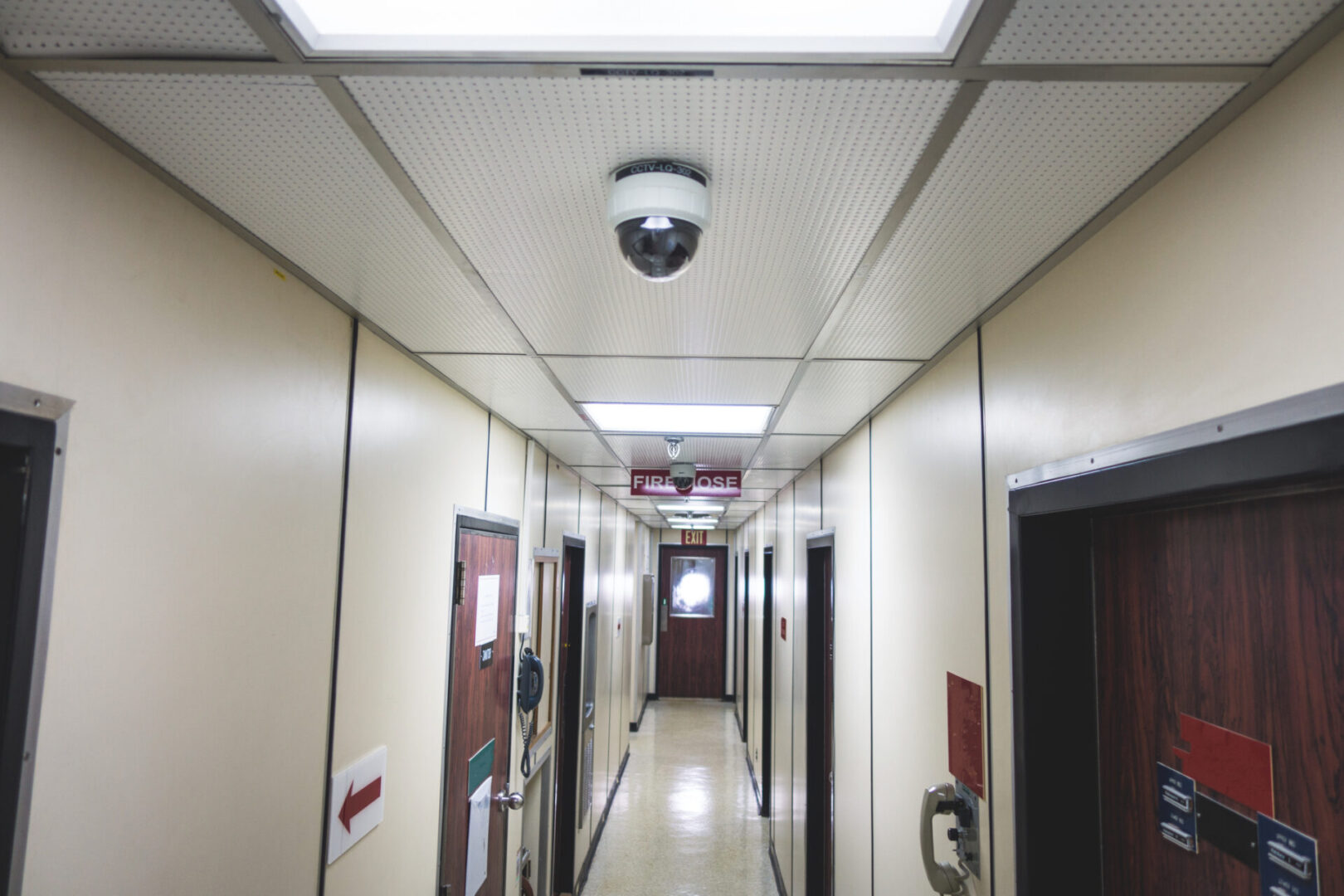 Corridor with security camera and doors